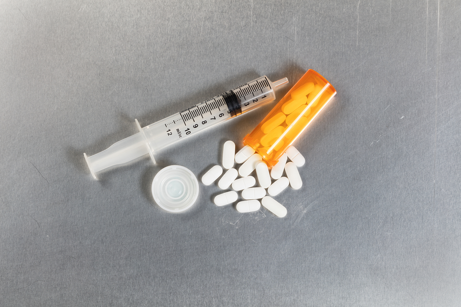 Pills and a syringe