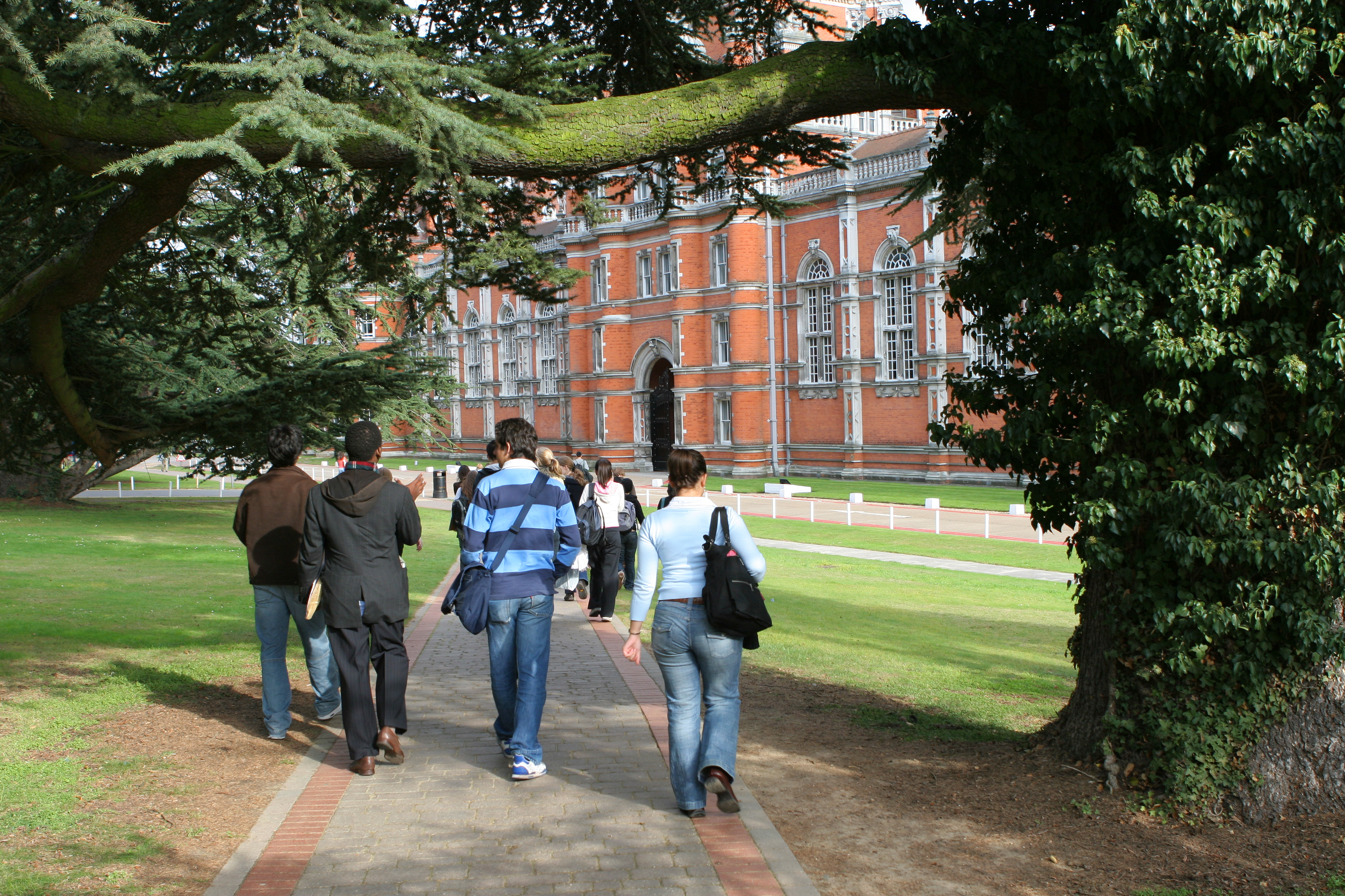 group of students walking to university building