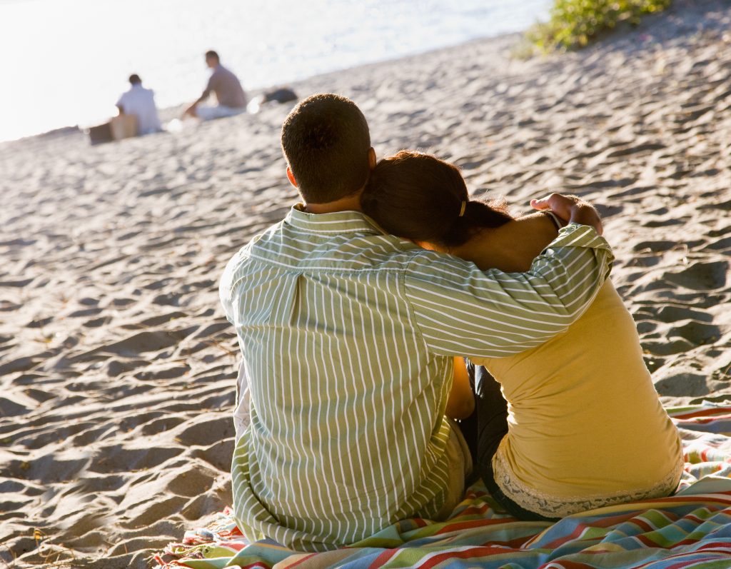 Couple hugging at beach