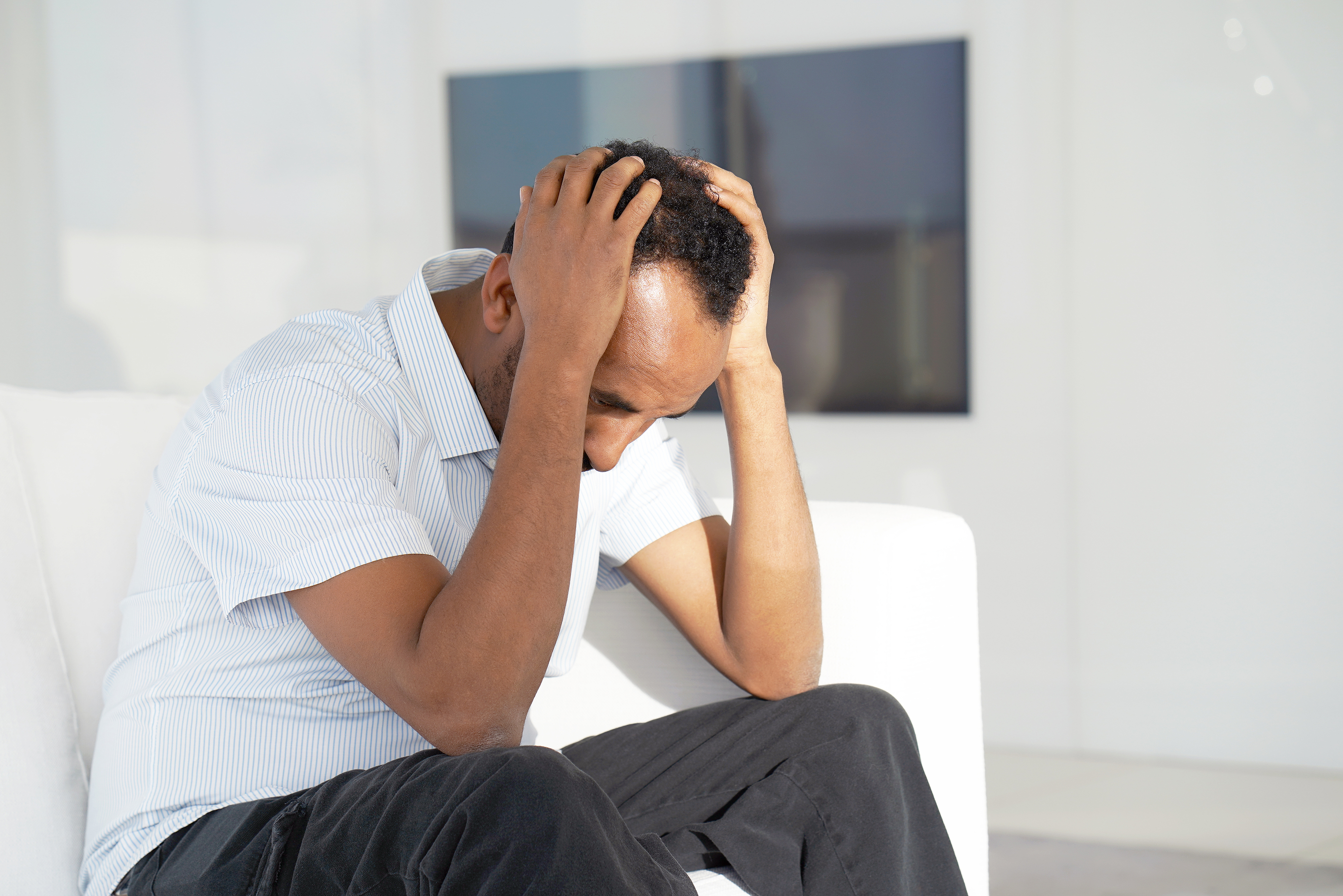 Loss Of A Loved One. Grief In The Family. Death Of A Child. Sad Loss of a loved one. Grief in the family. Death of a child. Sad face depressed african man. Very sad man. Concept of loneliness and pain.
