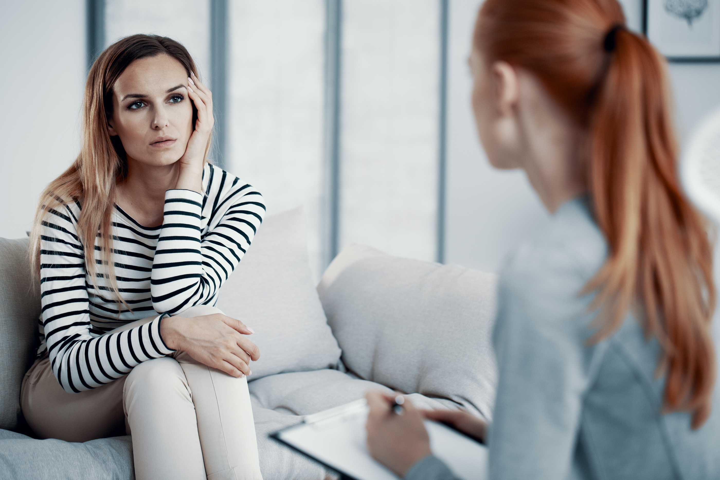 Woman with anorexia speaking with therapist