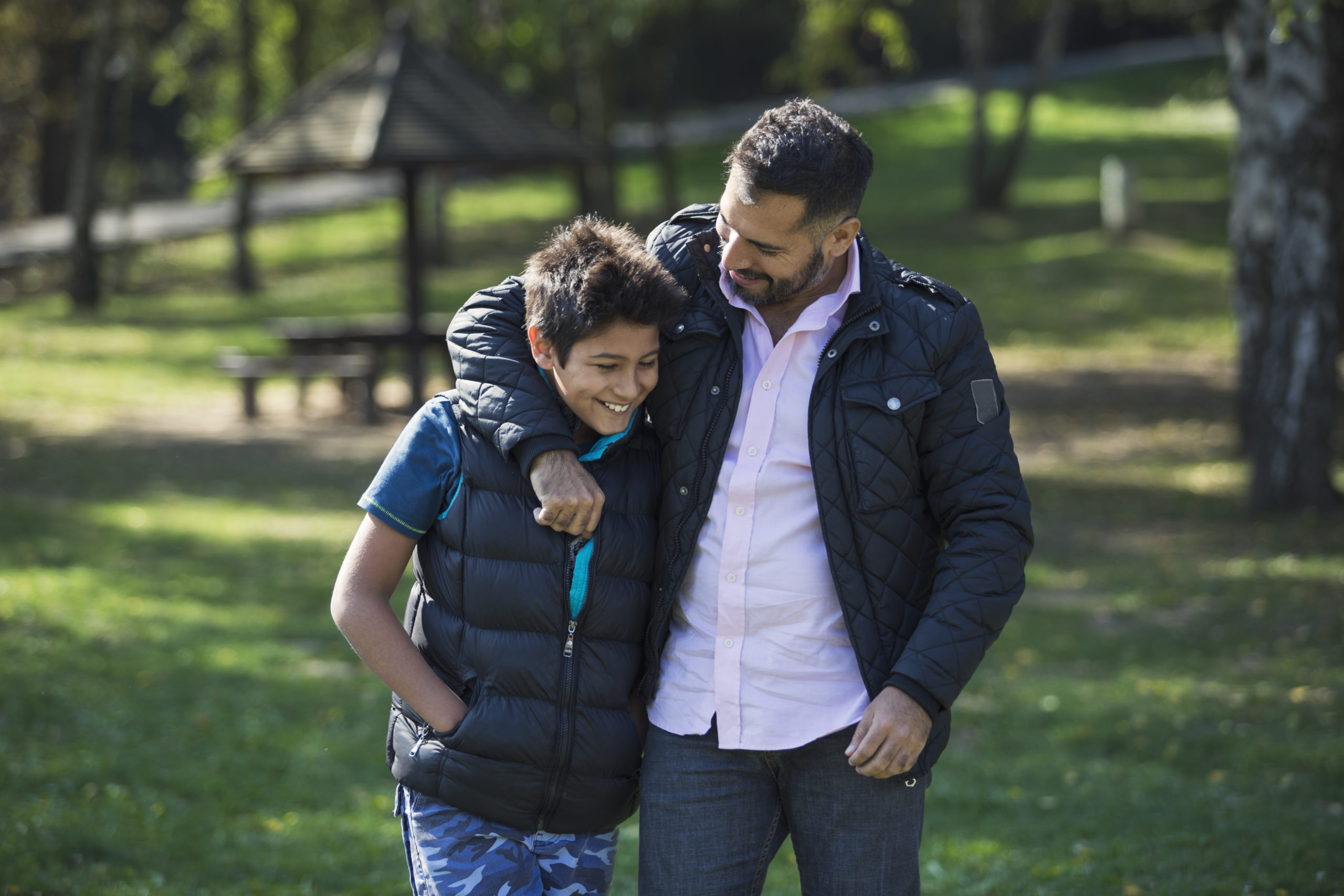 Father and son in public park