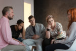 red-haired-girl-talking-to-psychotherapist-about-problems-during-meeting-for-teenagers-stockpack-istock