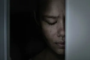 a-scaared-woman-depressed-hiding-in-the-closet-ashamed-and-frightened-stockpack-gettyimages
