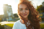 portraits-of-a-charming-red-haired-girl-with-a-cute-face-girl-posing-for-the-camera-in-the-city-center-she-has-a-wonderful-mood-and-a-lovely-smile-stockpack-gettyimages