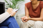 faceless-professional-psychologist-taking-notes-on-clipboard-while-counseling-woman-on-couch-in-office-stockpack-gettyimages Faceless professional psychologist taking notes on clipboard while counseling woman on couch in office