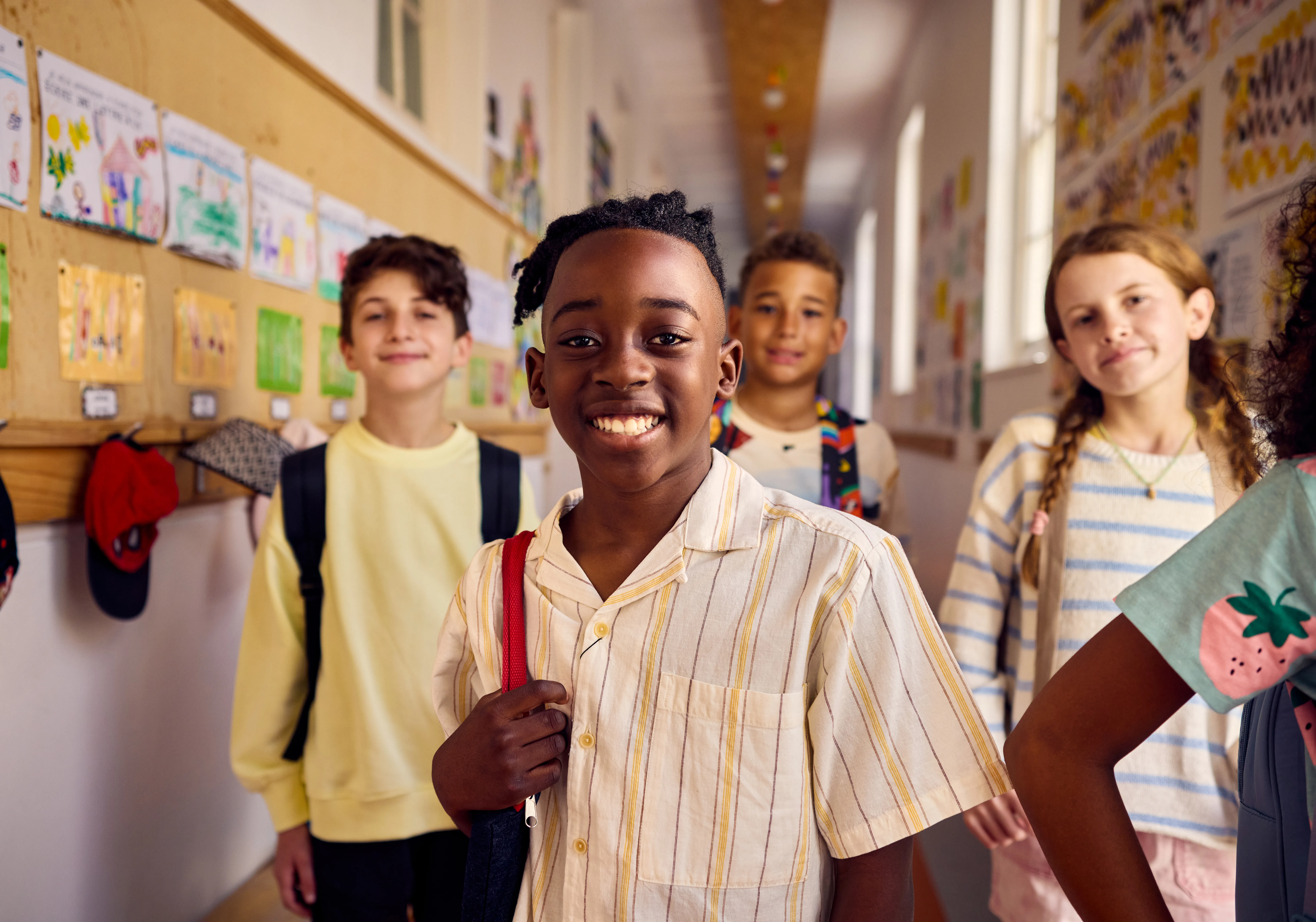 Smiling tweens attend school
