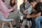 Young adult receiving mental health evaluation from mobile crisis team
