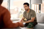 support-therapy-and-a-military-man-with-a-psychologist-for-counselling-depression-and-psychology-young-army-veteran-or-soldier-person-with-a-therapist-for-mental-health-consultation-or-help-stockpack-gettyimages Support, therapy and a military man with a psychologist for counselling, depression and psychology. Young army, veteran or soldier person with a therapist for mental health, consultation or help