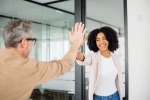 the-colleagues-exchange-a-high-five-their-smiles-reflecting-a-culture-of-achievement-and-mutual-respect-in-a-bright-modern-office-setting-the-action-signifies-a-successful-collaboration-stockpack-gettyimages The colleagues exchange a high-five, their smiles reflecting a culture of achievement and mutual respect in a bright, modern office setting. The action signifies a successful collaboration