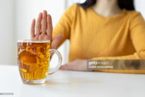 Woman alcoholic social problems concept sitting refusal of alcohol wondering if she has a alcohol problem